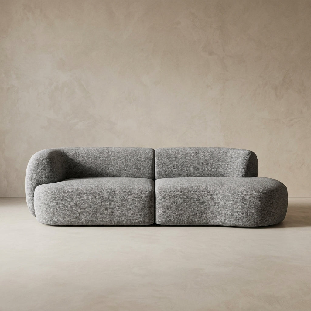 Gray sofa against a beige wall